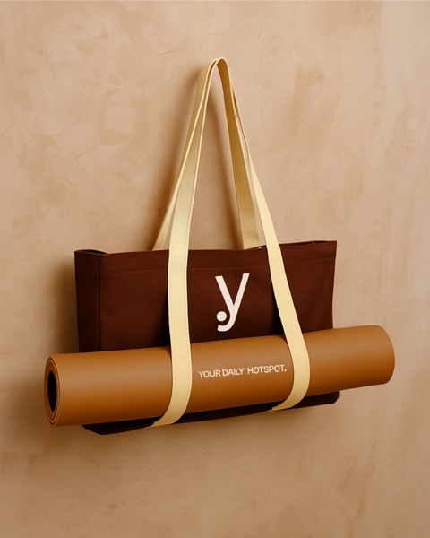 A high-end, studio-lit shot of a Yoga Mat Tote Bag featuring clean, earthy tones and minimalist text placement.